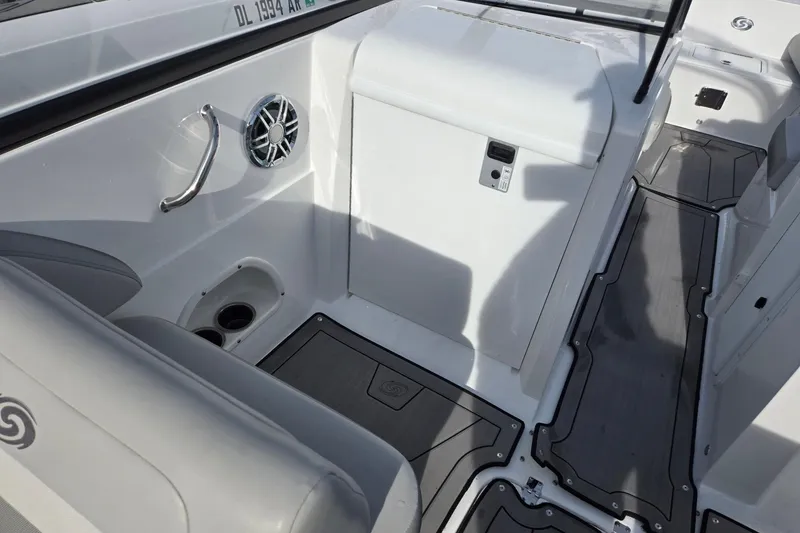 Slide: The Image of 2024 Godfrey Hurricane 235SD boat interior with seating, speaker, and cup holders. - 27