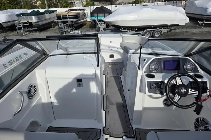 Slide: The Image of 2024 Godfrey Hurricane 235SD boat interior with modern dashboard and steering wheel. - 9