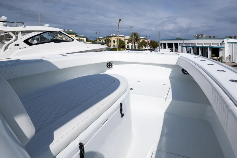 Slide: The Image of Freeman 34 boat interior, 2022 model, featuring sleek white seating and modern design. - 12