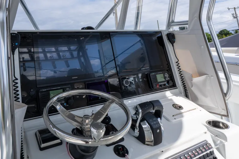 Slide: The Image of 2022 Freeman 34 boat helm with advanced navigation and control systems. - 14