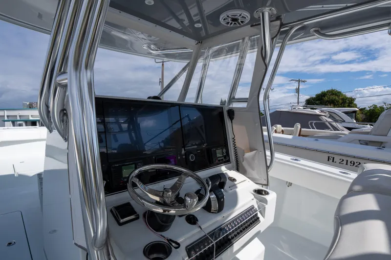 Slide: The Image of 2022 Freeman 34 boat cockpit with modern steering and navigation system. - 17