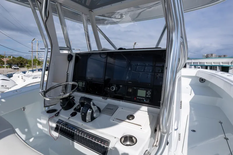 Slide: The Image of 2022 Freeman 34 boat cockpit with advanced navigation and control systems. - 18