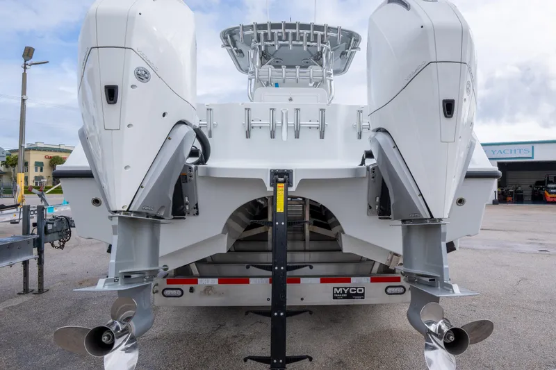Slide: The Image of 2022 Freeman 34 boat with dual outboard engines on a trailer. - 22