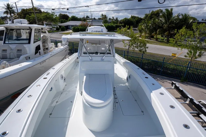Slide: The Image of 2022 Freeman 34 boat with sleek design, spacious deck, and advanced Garmin navigation system. - 9