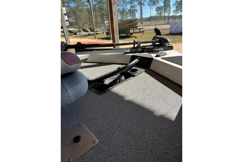 Slide: The Image of 2025 G3 Sportsman 1710 boat interior with seating and equipment, outdoor setting. - 3