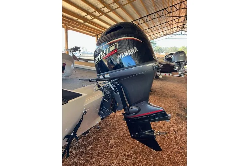 Slide: The Image of 2025 G3 Sportsman 1710 with Yamaha outboard motor in covered storage. - 8
