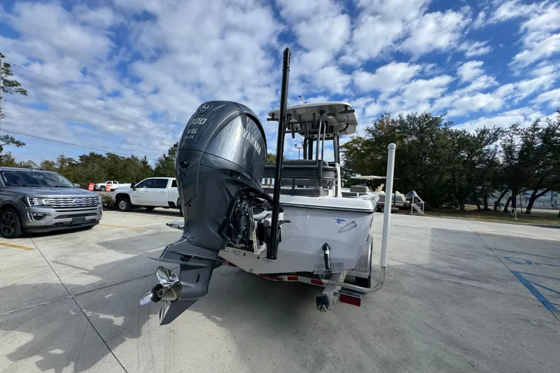 Slide: The Image of 2026 Sea Born FX261 Bay boat with Yamaha engine in parking lot under cloudy sky. - 13