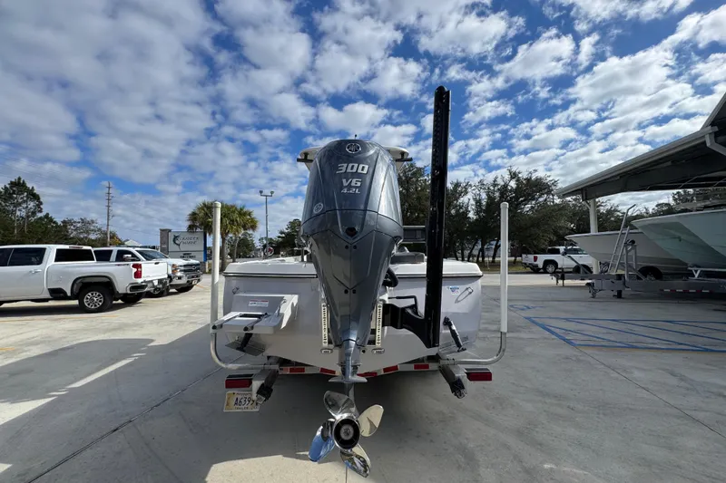 Slide: The Image of 2026 Sea Born FX261 Bay boat with powerful 300 V6 engine in a sunny marina. - 14