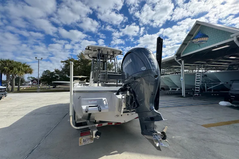 Slide: The Image of 2026 Sea Born FX261 Bay boat with Yamaha engine in a marina setting. - 15