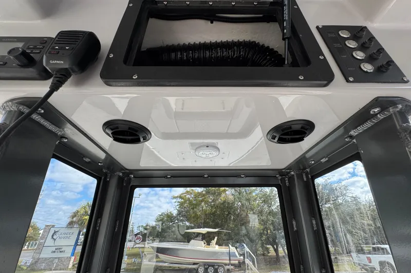 Slide: The Image of Interior view of 2026 Sea Born FX261 Bay boat with control panel and windows. - 35