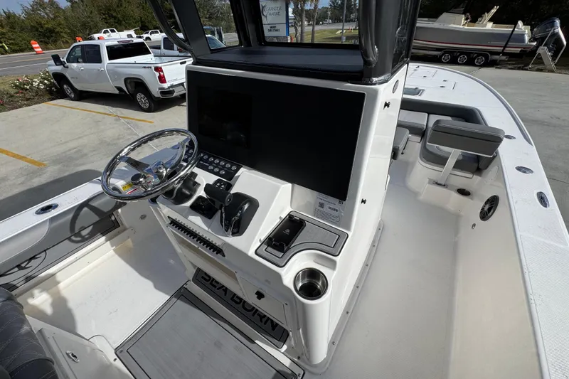 Slide: The Image of 2026 Sea Born FX261 Bay boat interior with steering wheel and control panel. - 36