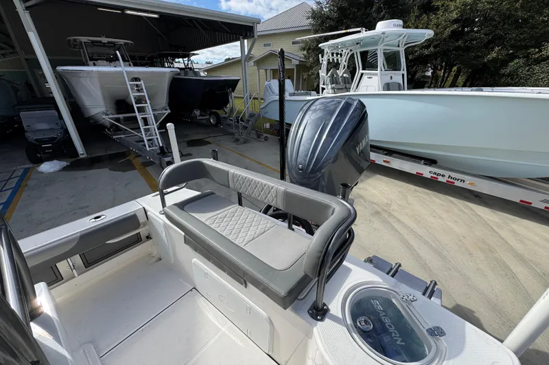 Slide: The Image of 2026 Sea Born FX261 Bay boat with Yamaha engine in a marina setting. - 40