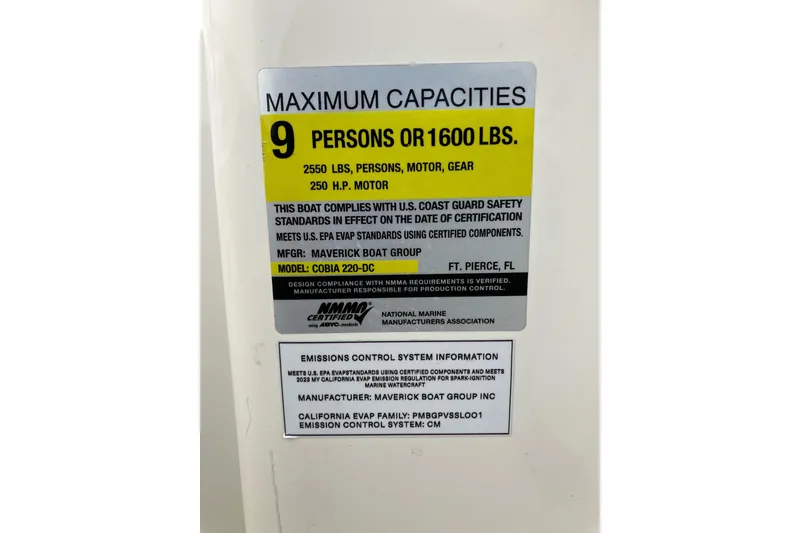 Slide: The Image of 2024 Cobia 220 Dual Console capacity label, 9 persons or 1600 lbs, 250 HP motor. - 8