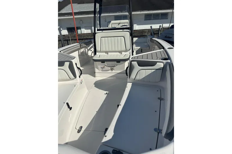 Slide: The Image of 2020 Yamaha Boats 210 FSH interior, featuring spacious seating and modern design. - 11