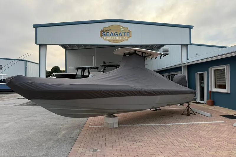 Slide: The Image of 2023 Pathfinder 2600 TRS boat covered, parked at Seagate Marine Sales. - 1