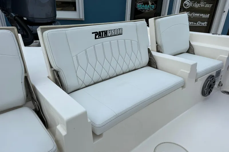 Slide: The Image of 2023 Pathfinder 2600 TRS boat seats with white upholstery and logo detail. - 13