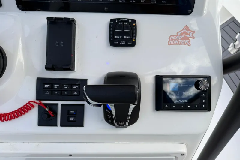 Slide: The Image of Control panel of 2023 Pathfinder 2600 TRS boat with audio system and throttle. - 22