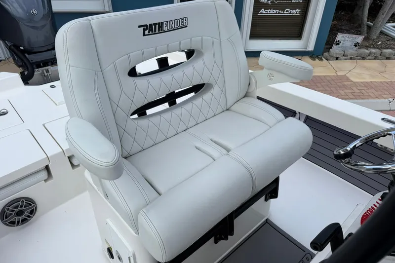 Slide: The Image of 2023 Pathfinder 2600 TRS boat seat with white upholstery and armrests. - 23