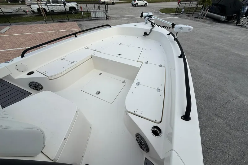 Slide: The Image of 2023 Pathfinder 2600 TRS boat deck with storage compartments and seating. - 26