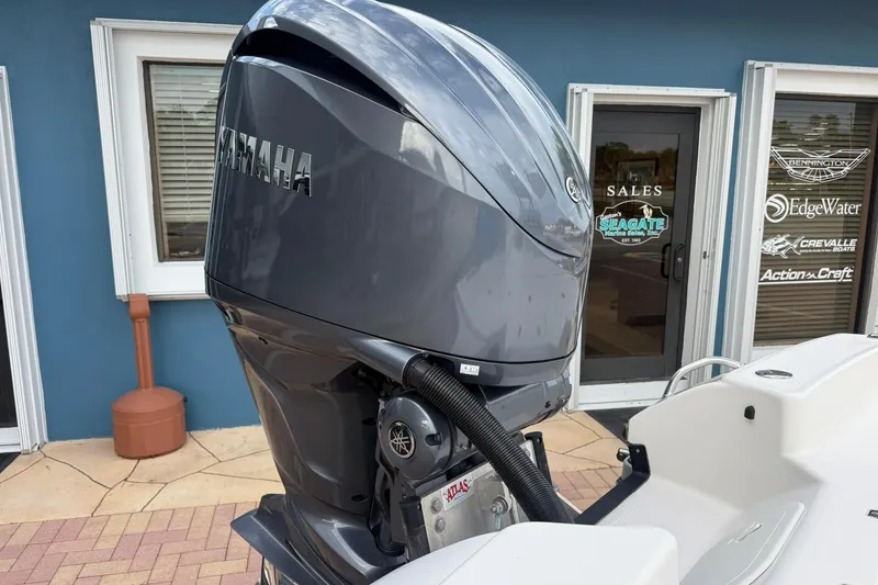 Slide: The Image of 2023 Pathfinder 2600 TRS with Yamaha outboard motor at a sales location. - 9