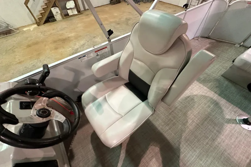 Slide: The Image of Captain's chair and steering wheel of 2019 SunCatcher V22 Cruise boat. - 13