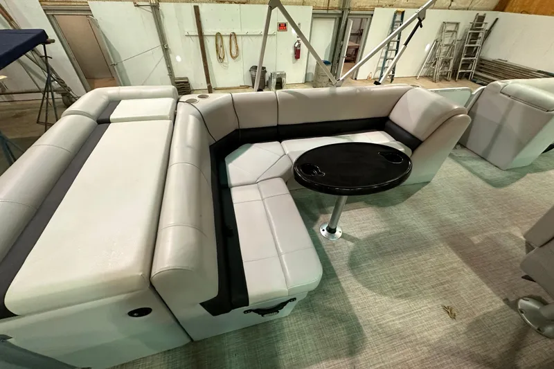 Slide: The Image of 2019 SunCatcher V22 Cruise boat interior with plush seating and a round table. - 15