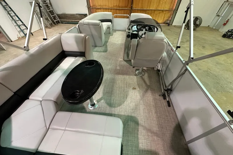Slide: The Image of Interior of 2019 SunCatcher V22 Cruise pontoon boat with seating and table. - 17
