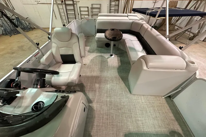 Slide: The Image of Interior of 2019 SunCatcher V22 Cruise pontoon boat with seating and steering console. - 21