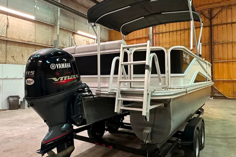Slide: The Image of 2019 SunCatcher V22 Cruise pontoon boat with Yamaha VMAX outboard in a warehouse. - 4