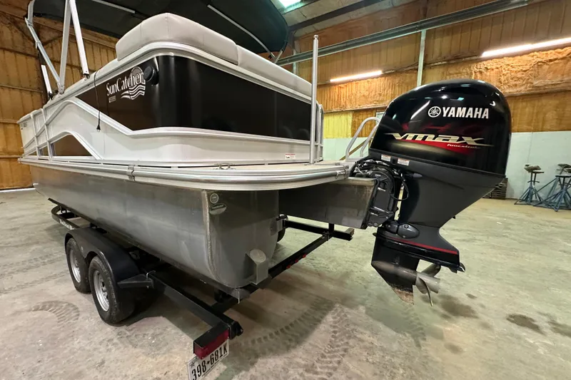 Slide: The Image of 2019 SunCatcher V22 Cruise boat with Yamaha VMAX engine in a garage. - 6