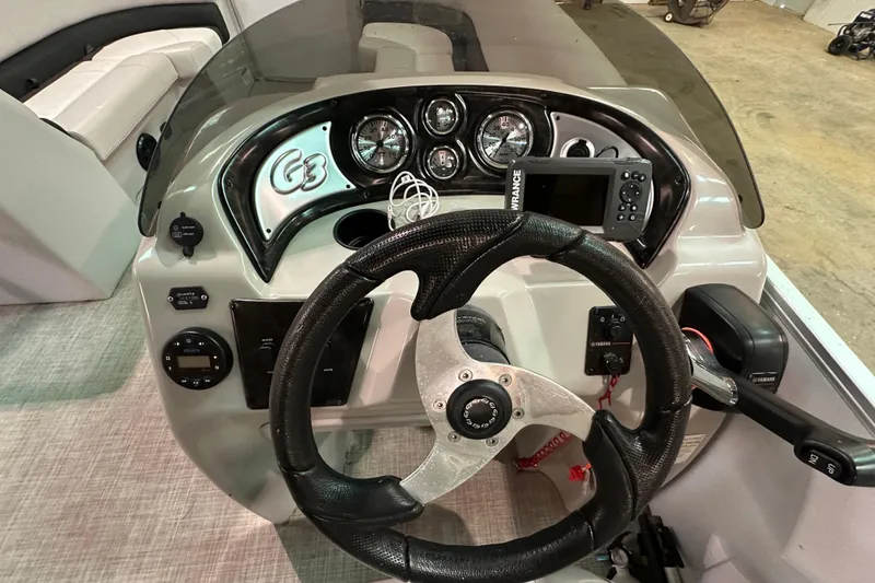 Slide: The Image of Steering console of 2019 SunCatcher V22 Cruise boat with gauges and controls. - 9