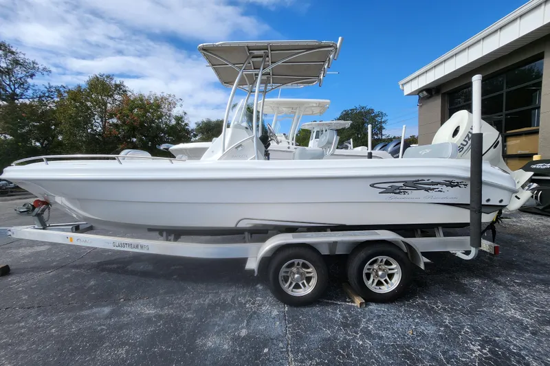 The Image of 2020 Glasstream 240 CCX boat on trailer, parked outdoors near a building. - 0