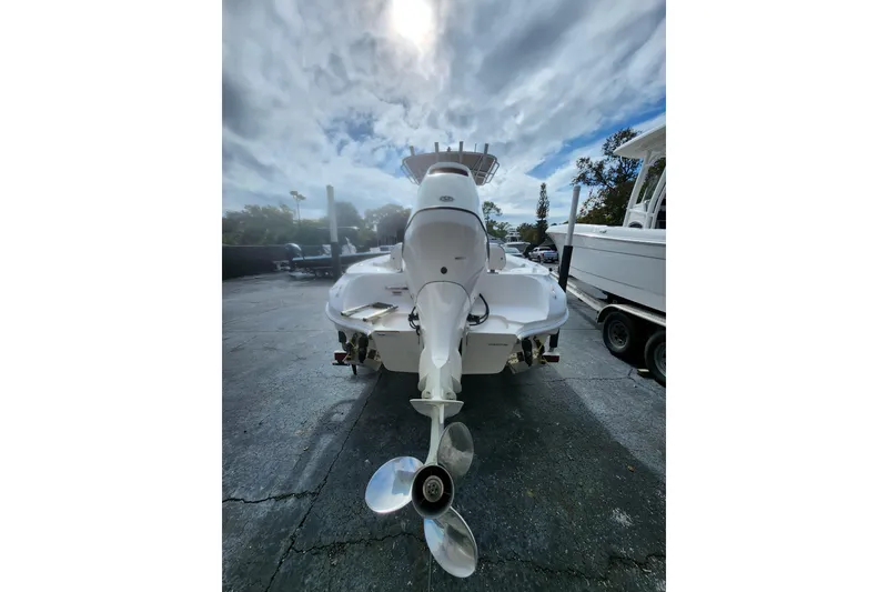 Slide: The Image of 2020 Glasstream 240 CCX boat rear view with outboard motor under cloudy sky. - 3