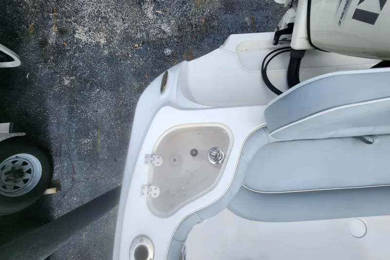 Slide: The Image of 2020 Glasstream 240 CCX boat interior with seating and storage compartment. - 5