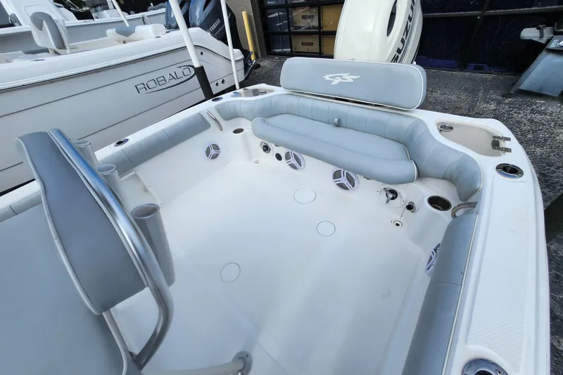 Slide: The Image of 2020 Glasstream 240 CCX boat interior with seating and cup holders. - 8