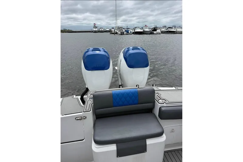 Slide: The Image of 2008 Donzi 32 ZF boat with dual engines, docked in a marina. - 6