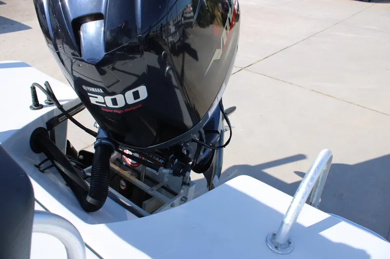 Slide: The Image of 2020 Blazer 2220 GTS boat interior with open storage compartment and Yamaha 200 engine. - 10