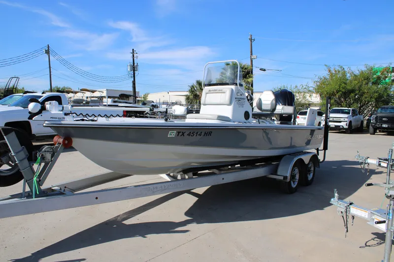 Slide: The Image of 2020 Blazer 2220 GTS boat on trailer in parking lot, sunny day. - 16