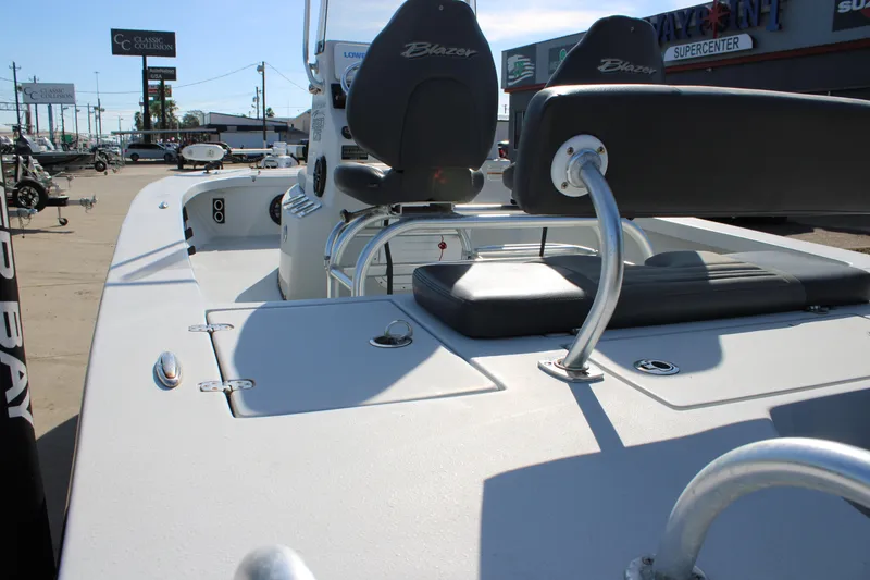 Slide: The Image of 2020 Blazer 2220 GTS boat with Minn Kota trolling motor, parked outdoors. - 21