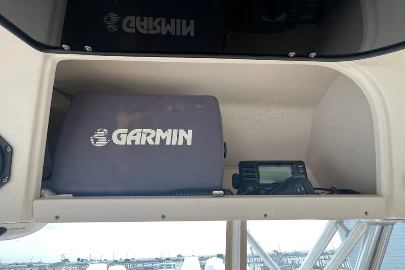 Slide: The Image of Storage compartment on 2006 Grady-White Express 330 with Garmin equipment. - 14