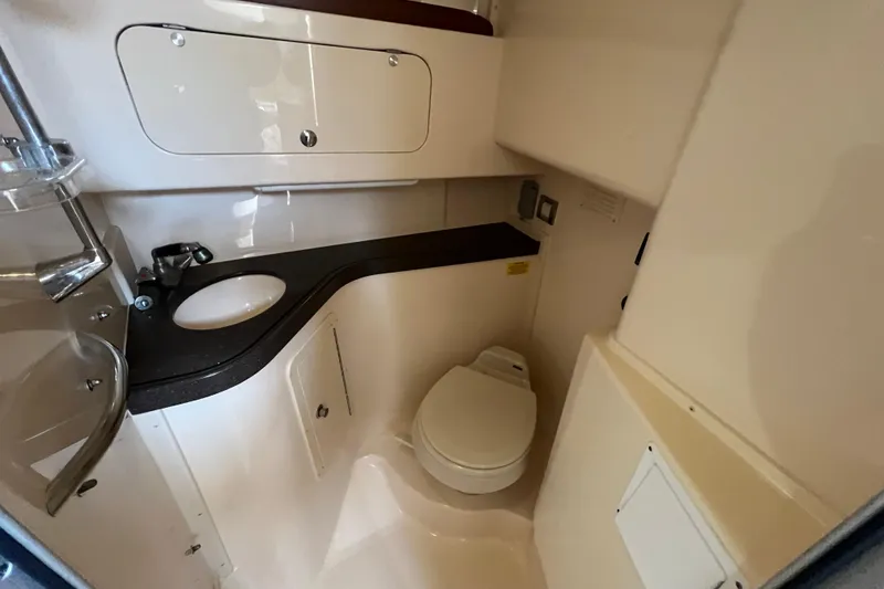 Slide: The Image of 2006 Grady-White Express 330 boat bathroom with sink and toilet. - 21