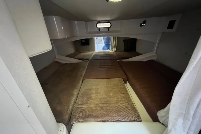 Slide: The Image of 2006 Grady-White Express 330 cabin interior with cozy sleeping area. - 22