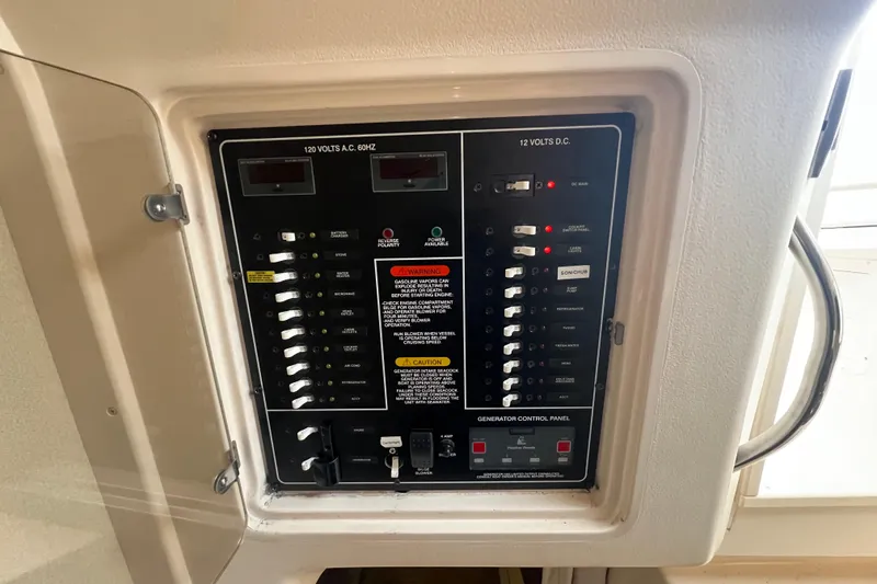 Slide: The Image of Electrical control panel on a 2006 Grady-White Express 330 boat. - 23