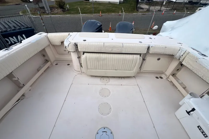 Slide: The Image of 2006 Grady-White Express 330 boat deck with seating and storage compartments. - 7