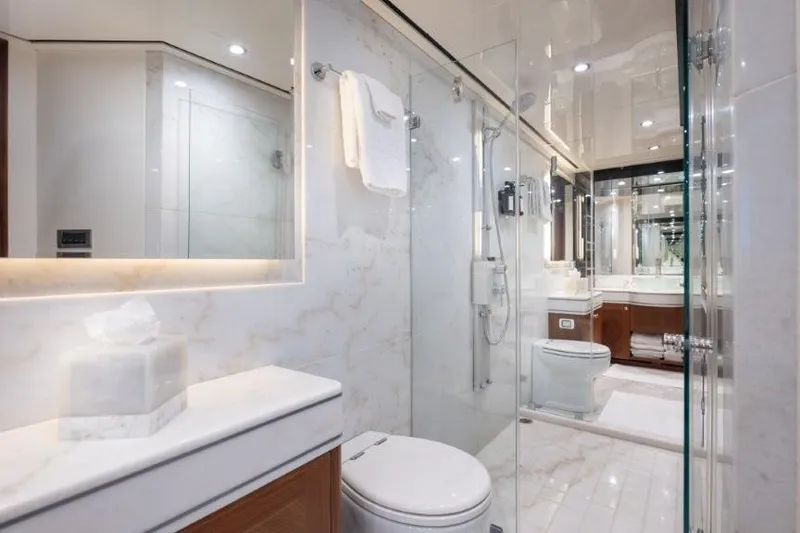 Slide: The Image of Luxurious bathroom in 2017 Ocean Alexander motor yacht with marble accents and glass shower. - 37