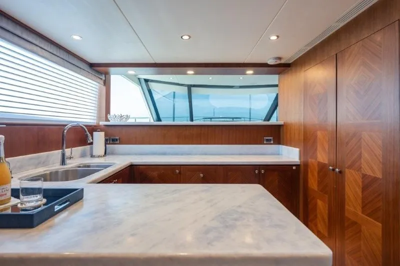 Slide: The Image of Luxurious kitchen interior of 2017 Ocean Alexander Motor Yacht with marble countertops. - 49
