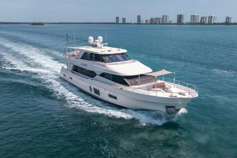 Slide: The Image of 2017 Ocean Alexander Motor Yacht cruising on blue water near city skyline. - 5