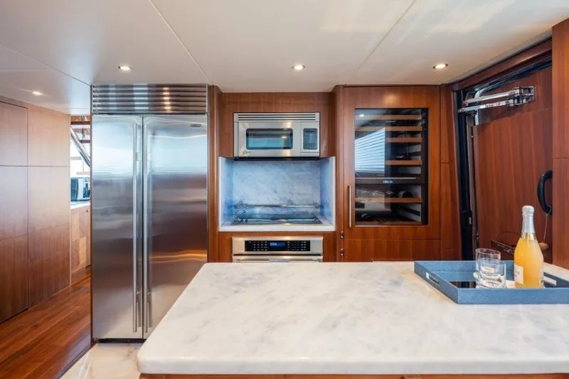 Slide: The Image of Luxurious kitchen in 2017 Ocean Alexander motor yacht with modern appliances and marble countertop. - 50