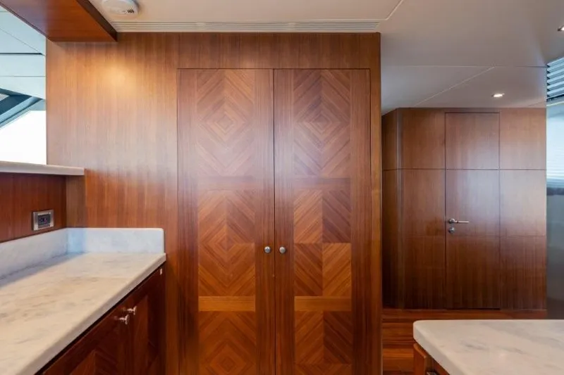 Slide: The Image of Luxurious wood interior of 2017 Ocean Alexander Motor Yacht with marble countertops. - 51