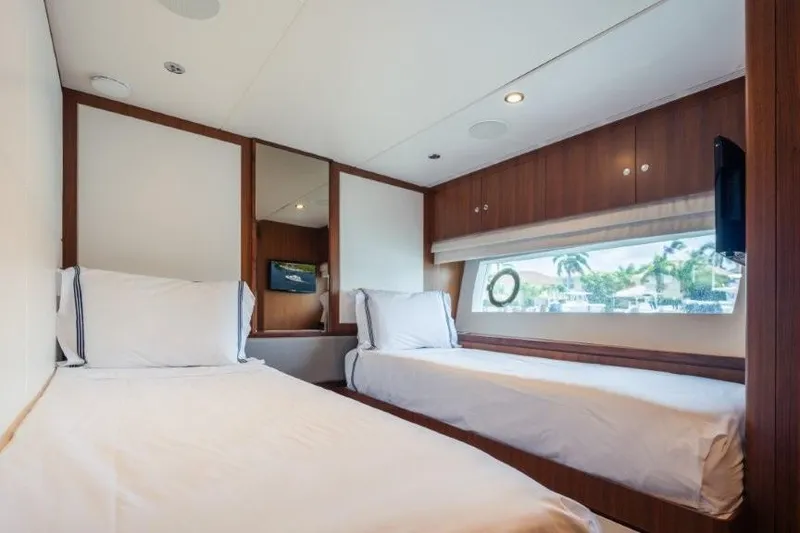 Slide: The Image of Luxurious 2017 Ocean Alexander motor yacht cabin with twin beds and scenic window view. - 52